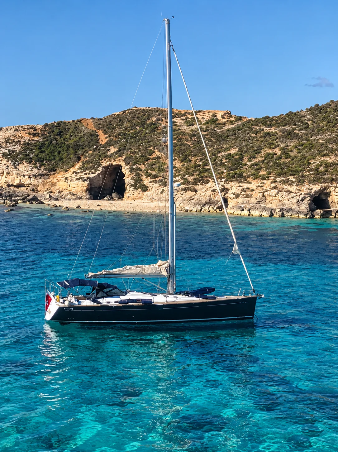 ACE at anchor off a quiet beach in Gozo